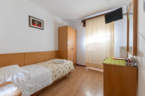 Postel nebo postele na pokoji v ubytování Hotel Edelweiss