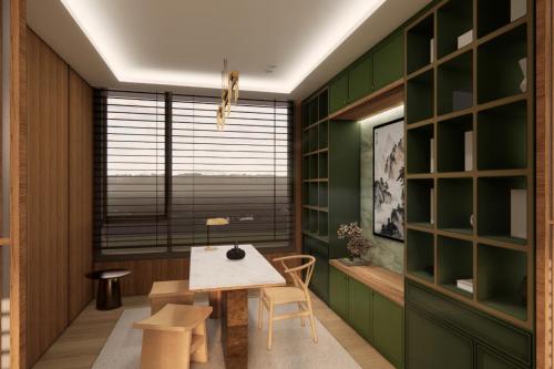 a dining room with green walls and a table and chairs at Maxim Hotel - Auckland in Auckland