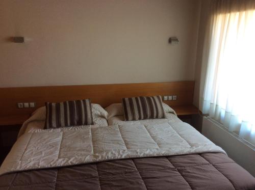 Katil atau katil-katil dalam bilik di Hotel Viaurelia