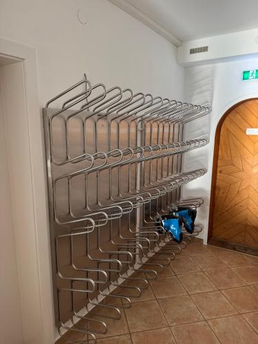 a bike rack in a wall in a room at Loetje in Gosau
