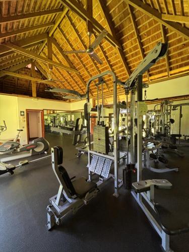 a gym with a lot of equipment in a building at Le Fare Tianee, Résidence Légends, BEST VIEW in Moorea