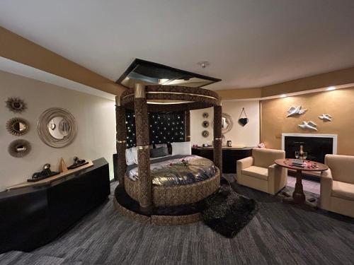 a bedroom with a large wooden bed in a room at Inn of the Dove - Romantic Luxury Suites with Jacuzzi & Seasonal Fireplace at Harrisburg-Hershey-Philadelphia, PA in Harrisburg