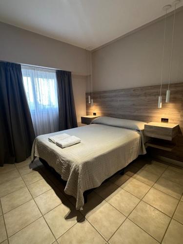 a bedroom with a large bed in a room at Departamento Junín 4 Bitcoins House in Corrientes