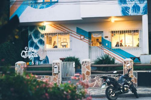 a motorcycle parked in front of a building at Hostel Like Quijote in San Carlos de Bariloche