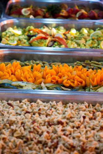 a display of different types of vegetables in trays at Crystal Hotel Bodrum in Gumusluk