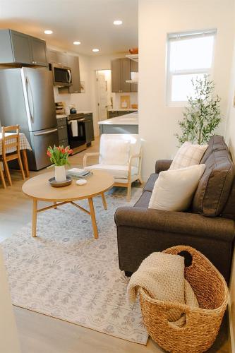 a living room with a couch and a table at Cozy Downtown Havens in Moscow