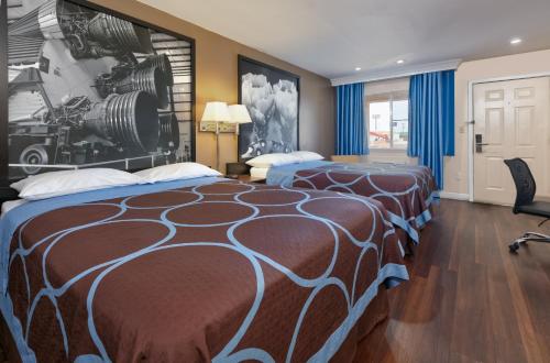 Katil atau katil-katil dalam bilik di Red River Inn Vernon, Tx