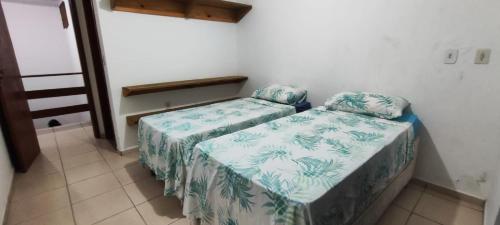 Katil atau katil-katil dalam bilik di Casa em Condomínio Conchas e Corais