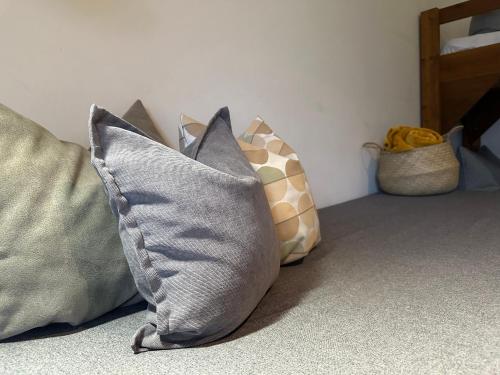 a group of pillows sitting on a couch at Pension Almhof Baumgarten in Bad Reichenhall