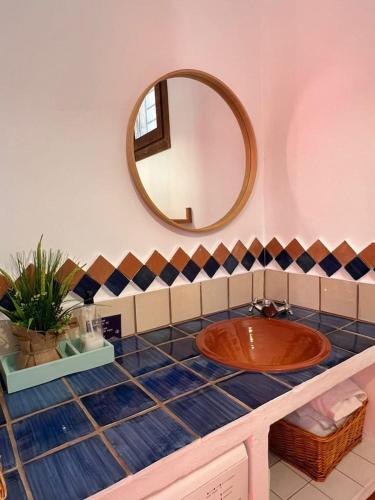 a bathroom with a sink and a mirror at Luna Lunera in Almería