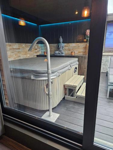 a view of a kitchen with a sink and a sink at Escape to Unwind in Putte