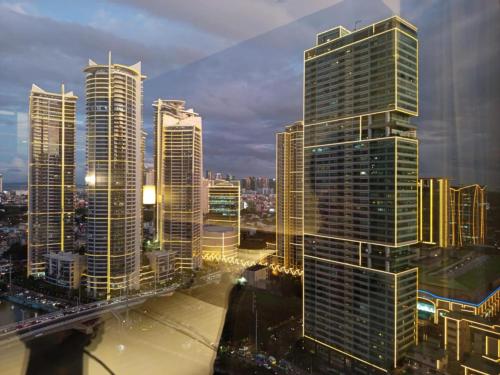 a view of a city with tall buildings at Novotel Hotel Residence Manila at Acqua in Manila
