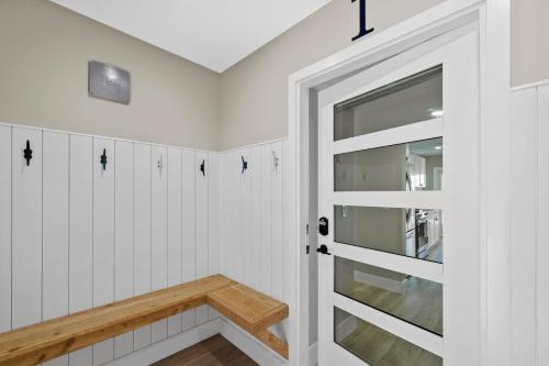a bathroom with white walls and a door at Chadwick Cove Marina in Englewood