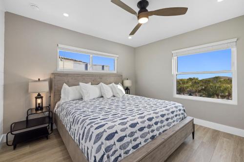 a bedroom with a bed and a ceiling fan at Chadwick Cove Marina in Englewood