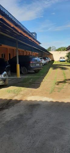 a group of cars parked in a parking lot at Pousada Boramar in Boracéia