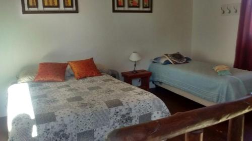 a bedroom with two beds in a room at Del carmen chica in Villa Giardino