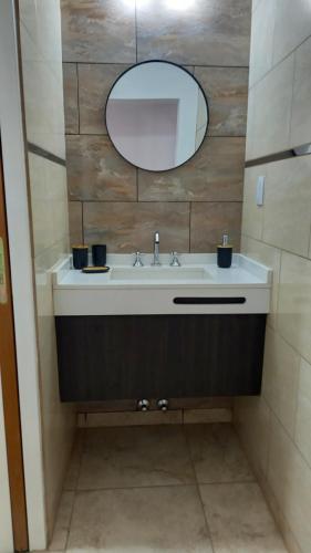 a bathroom with a sink and a mirror at La casita in La Falda