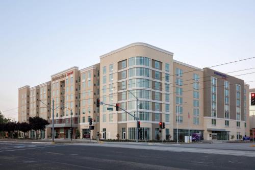 a large building on the corner of a street at Residence Inn by Marriott San Jose Airport in San Jose