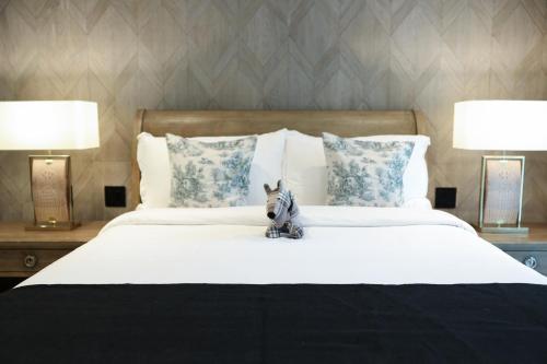 Giường trong phòng chung tại O:Live Boutique Hotel, A Small Luxury Hotel of the World