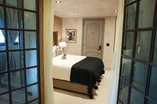 Giường trong phòng chung tại O:Live Boutique Hotel, A Small Luxury Hotel of the World