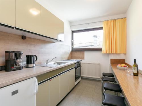 a kitchen with a sink and a counter top at Brixen Alpin Living Top 13 in Brixen im Thale