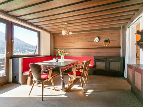 a dining room with a table and chairs at Brixen Alpin Living Top 16 in Brixen im Thale