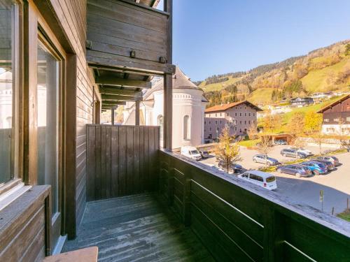 a balcony of a building with a view of a street at Brixen Alpin Living Top Alle in Brixen im Thale