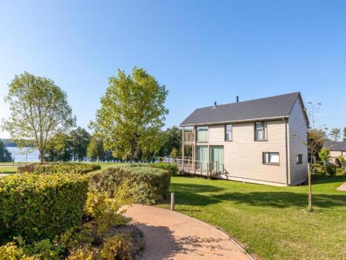 a house with a pathway leading to it at Serene Luxe Lakeside Stay in Boussu-lez-Walcourt