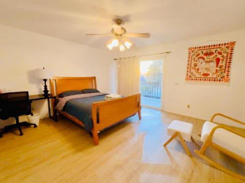 a bedroom with a bed and a ceiling fan at 1b1b Private and quiet sun roomA in Rancho Cucamonga