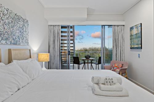 Katil atau katil-katil dalam bilik di Penthouse with Rooftop and Spa - 3 BR Bali Resort in Kingscliff 1324