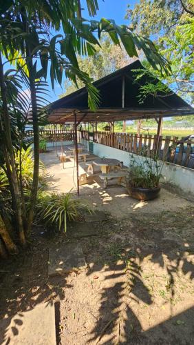 a pavilion with a picnic table in a park at Baan Suan Resort Doisaket 1 in Ban Tha