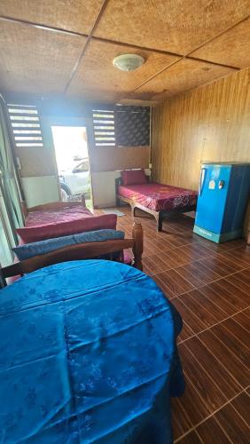 a room with three beds on a boat at Baan Suan Resort Doisaket 1 in Ban Tha