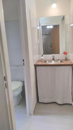 a bathroom with a sink and a toilet at Remanso del Citon in Salsipuedes