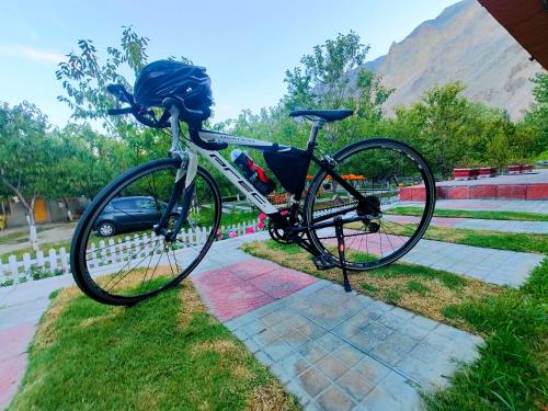 a bike parked on the side of a sidewalk at Das-e-Basi in Gilgit