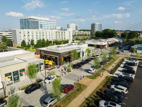 an aerial view of a parking lot in a city at Staybridge Suites - Charlotte Ballantyne by IHG in Charlotte
