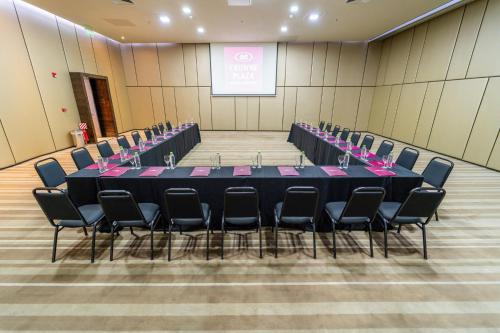 a conference room with a long table and chairs at Crowne Plaza Asunción by IHG in Asuncion