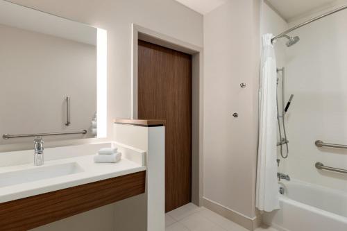 a bathroom with a sink and a shower at Holiday Inn Express & Suites - Dalton - Walnut Ave by IHG in Dalton