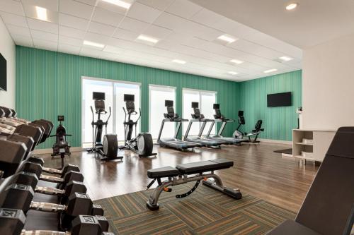 a gym with several treadmills and machines in a room at Holiday Inn Express & Suites - Dalton - Walnut Ave by IHG in Dalton