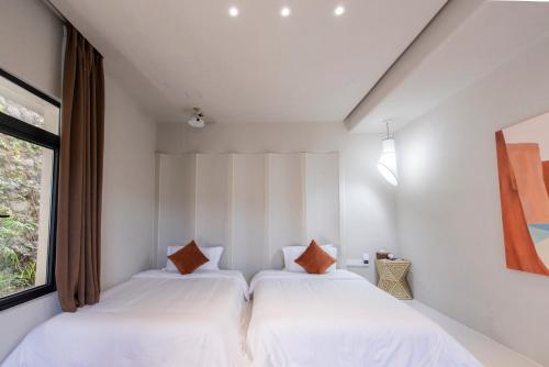Katil atau katil-katil dalam bilik di YOOOO SEA TRUE REST Hotel