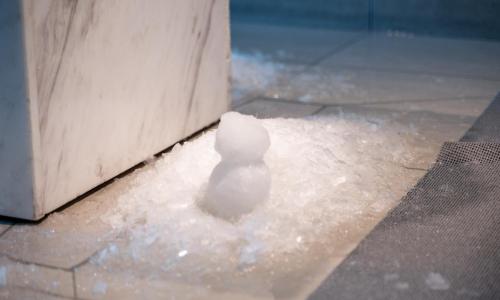 a white toy animal sitting next to a door at Oiso Prince Hotel in Oiso