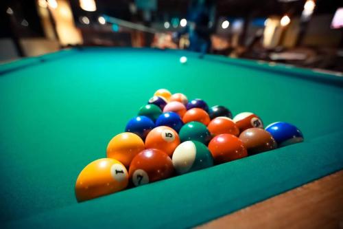 a group of billiard balls on a pool table at Hotel Pousada Villas do Atlântico in Lauro de Freitas
