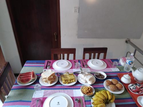 a table with plates of food on top at SILVER RAIL in Galle
