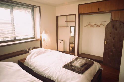 Postel nebo postele na pokoji v ubytování Guesthouse LOOP