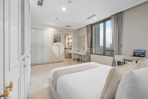 En eller flere senge i et værelse på Brassia by Kozystay - Thamrin