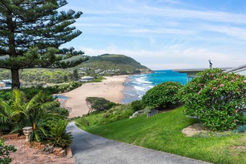 a view of the beach from a house at Stanwell Park Escape - Sprawling Beachfront Living in Stanwell Park