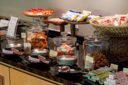 a counter with jars of food and other food items at Chalet Ivy Jozankei in Jozankei