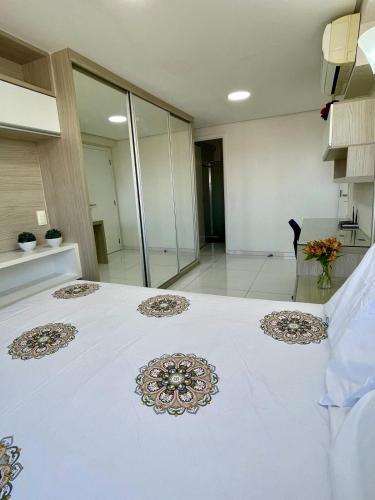a large white bed in a large room at Charmosa Cobertura 1103B in Maceió