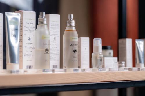 a shelf with bottles of hair products on it at Chalet Ivy Jozankei in Jozankei
