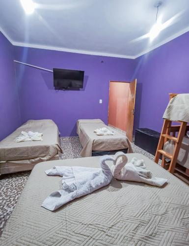 Postel nebo postele na pokoji v ubytování Departamentos Los Abuelos