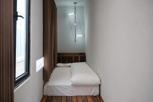 Katil atau katil-katil dalam bilik di YOOOO SEA TRUE REST Hotel